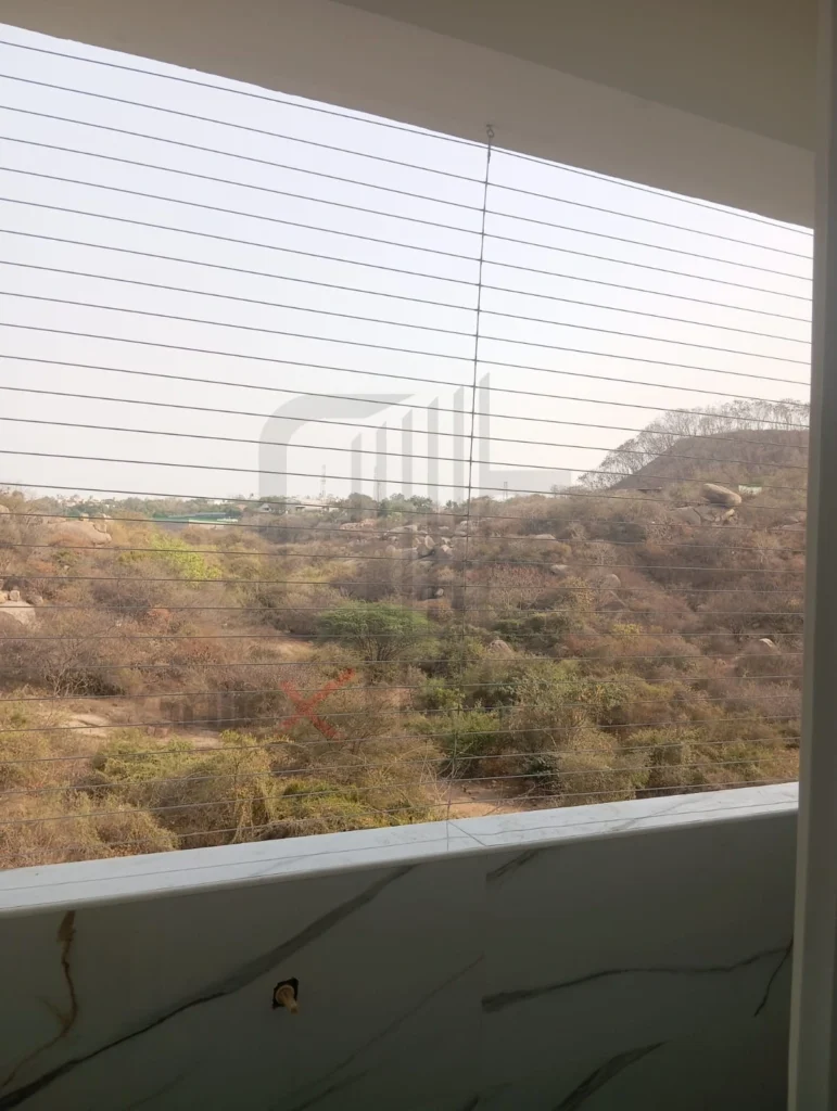 Invisible window grill installation in Nanakramguda Hyderabad by Grillex Enterprises